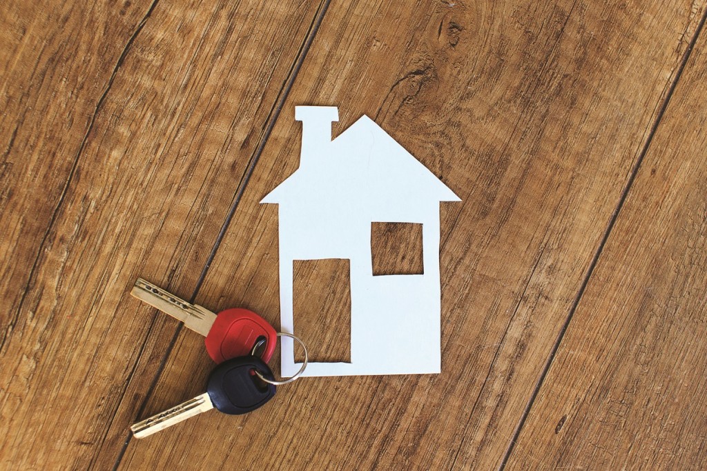 Keys and a cut out of a house