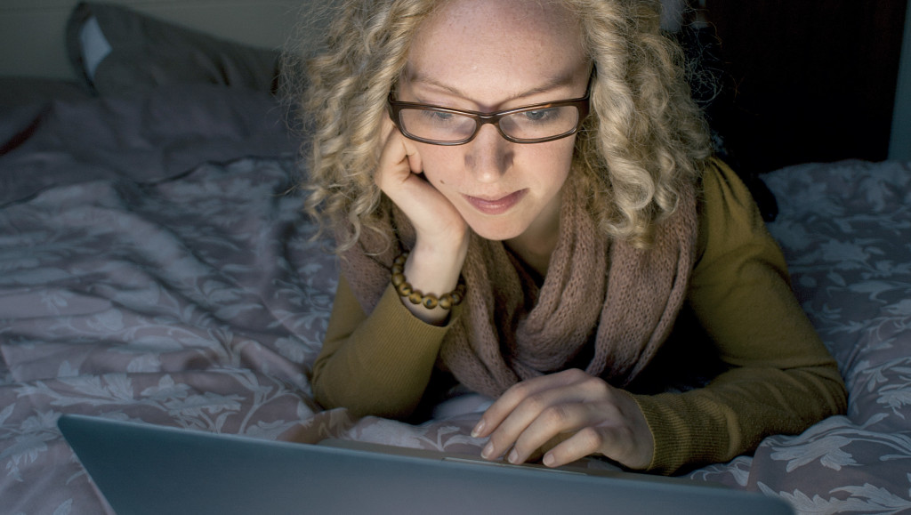 Emails - laptop lighting up face